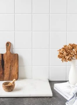 White kitchen background with brown kitchen utensils Stock Photos