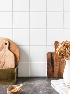 White kitchen background with brown kitchen utensils Stock Photos