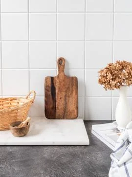 White kitchen background with brown kitchen utensils Stock Photos