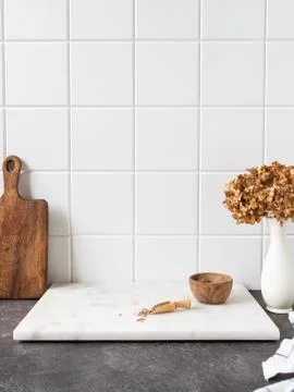White kitchen background with brown kitchen utensils Stock Photos