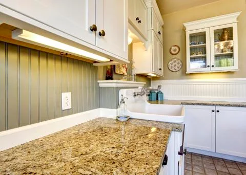 White kitchen cabinets with granite tops Stock Photos