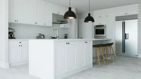 White kitchen interior with island, kitchen appliances and lighting. Stock Footage 253192580