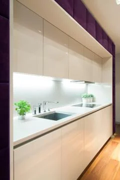 White kitchen with purple elements Stock Photos