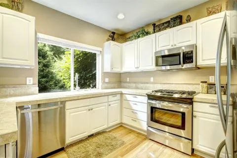 White kitchen room with window Stock Photos