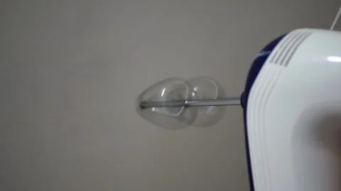 White kitchen stand mixer two rotating attachments making loud buzzing sound Video stock 320895217