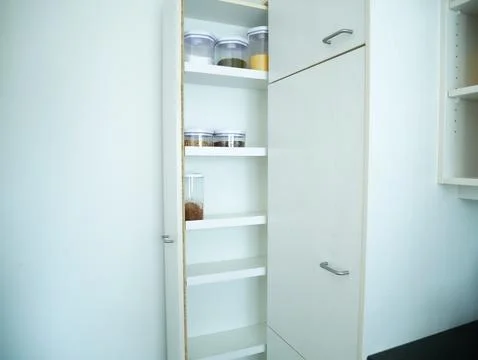 White Kitchen Storage Cabinet with Empty Shelves, Minimalist Home Organisation Stock Photos