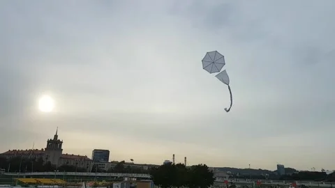 A white kite rises in the sky Stock Footage 167517192