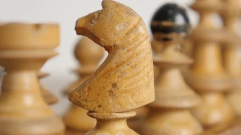 White knight positioned on chequered fields slow tilt Stock Footage 74543561