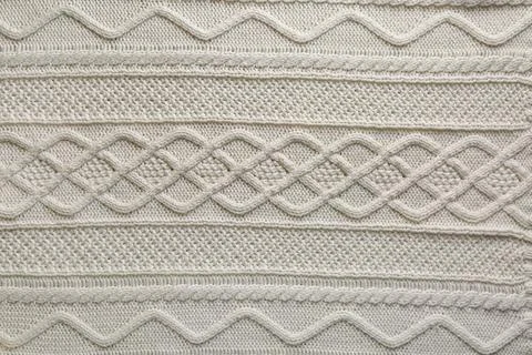 White knitted fabric with beautiful pattern as background, top view Stock Photos