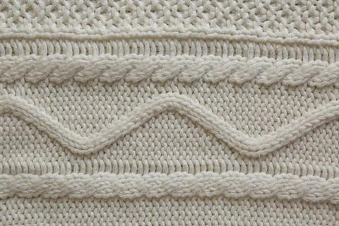 White knitted fabric with beautiful pattern as background, top view Stock Photos