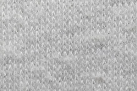 White knitted fabric texture macro warm wool clothing background Stockfoto's