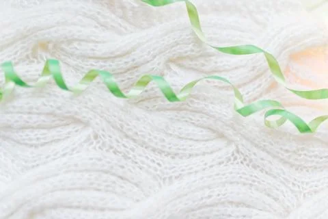 White knitted with a pattern textured background. Stock Photos