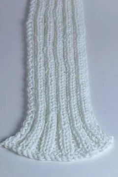 White knitted textured background with a pattern Stock Photos