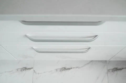 White lacquered kitchen facades on a comfortable kitchen. Modern white kitchen Stock Photos