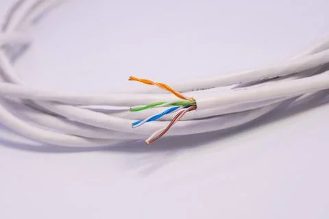 White lan cable rolled in circle on white background Stock Photos