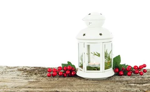 White lantern with candle inside and Christmas decoration. Copy space. Stock Photos