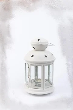 White lantern with candle inside and Christmas decoration on white background Foto stock