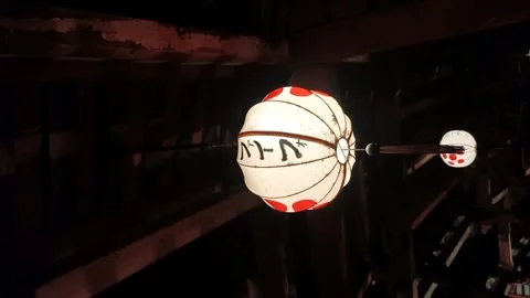 White lanterns with Japanese script swaying in soft wind 스톡 동영상 248554365