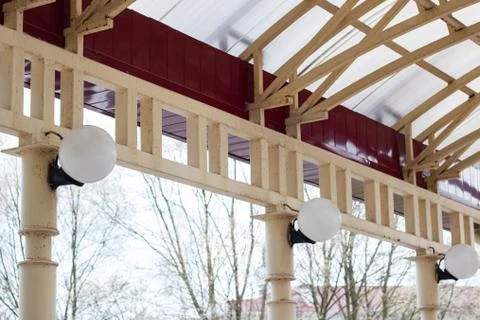 White lanterns in shape of ball on columns Stock Photos