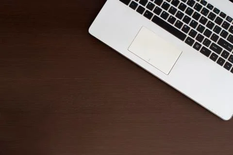 White laptop on a table Stock Photos