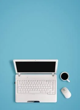 White laptop on table - place for text. Stock Photos