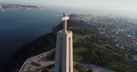 White large stone statue over the city and the sea aerial view Stock Footage 130168755