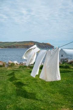 White laundry drying by the sea Stock Photos