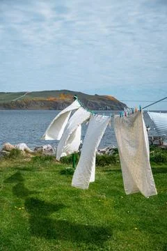 White laundry drying by the sea Stock Photos