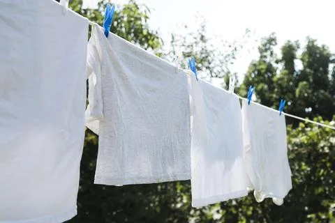 White laundry hanging string outdoors Stock Photos