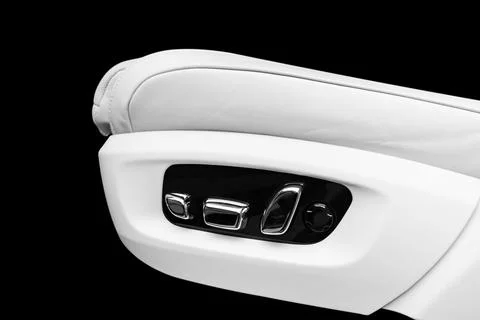 White leather interior of the luxury modern car. Perforated white leather c.. Stock Photos