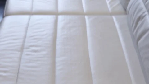 White leather sofa shallow texture slow tilting video . Leather beige sofa rough Stock Footage 104220077