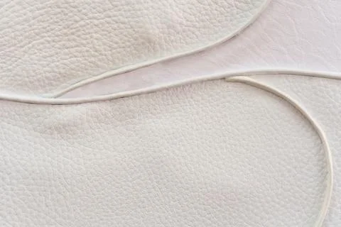 White leather texture with patterned stitching, used as a luxurious classic.. Stock Photos