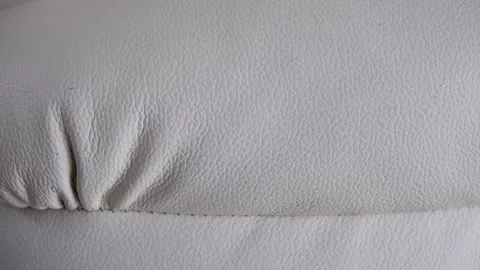 White leather upholstery texture with stitching and subtle wrinkles. Stock Footage 336123647
