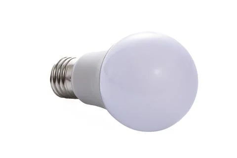 A white LED lamp with an E27 base lies on a white insulated background Stock Photos