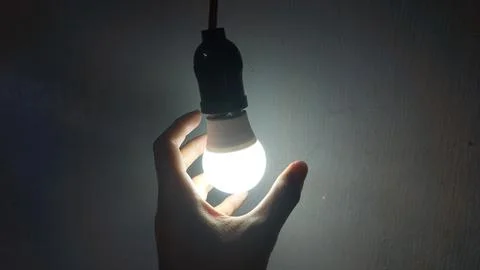 White LED light bulb product on a gray background Stock Photos