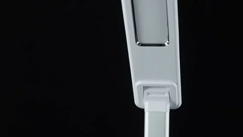 White LED table lamp on black background Stock Footage 152934436