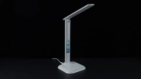 White LED table lamp on black background Stock Footage 152934452