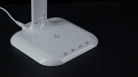 White LED table lamp on black background Stock Footage 152934462