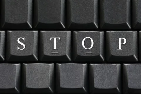 The white letter of Stop on computer keyboard background. Foto stock