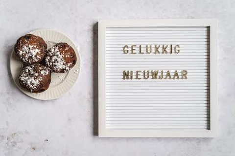 A white letterboard with Gelukkig Nieuwjaar (Dutch for Happy New Year) with.. Stock Photos