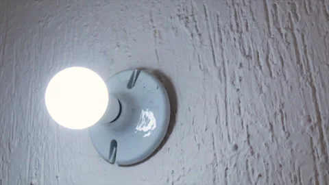 White light bulb constantly turns on and off at different speeds Stock-Footage 132527705