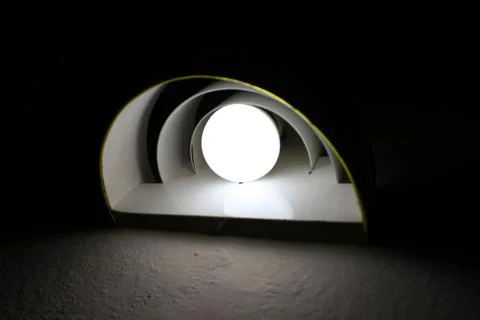 A white light bulb on the wall Foto stock