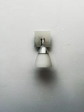 A white light fixture with a silver base Stock Photos