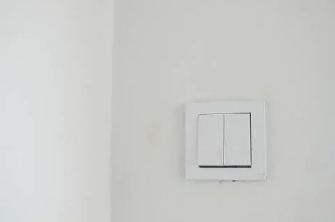 White light switch with white wall Foto stock