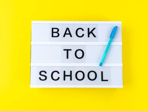 White lightbox with back to school text on yellow background Stock Photos