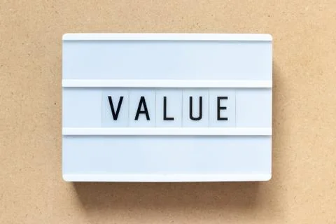 White lightbox with word value on wood background Foto stock