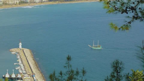 White lighthouse against the backdrop of the azure mediterranean sea Stock Footage 239545950