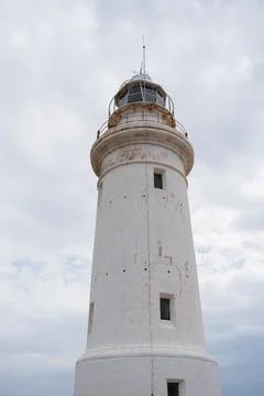 White lighthouse and cloudy sky as a background Stock-Fotos