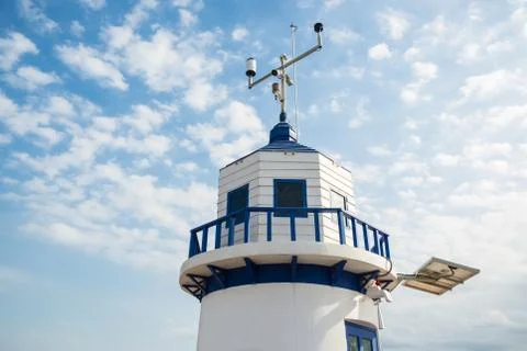 A white lighthouse with blue sky Stock Photos