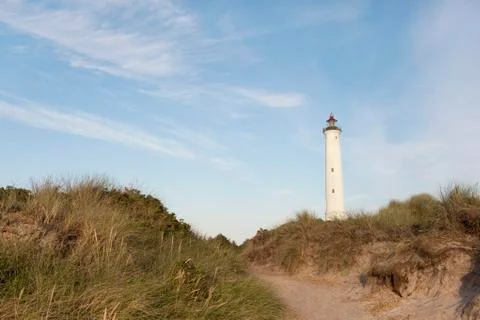 White lighthouse dunes Stock Photos